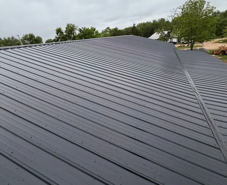 Standing seam metal roof installed by Sundown Roofing in North Arkansas