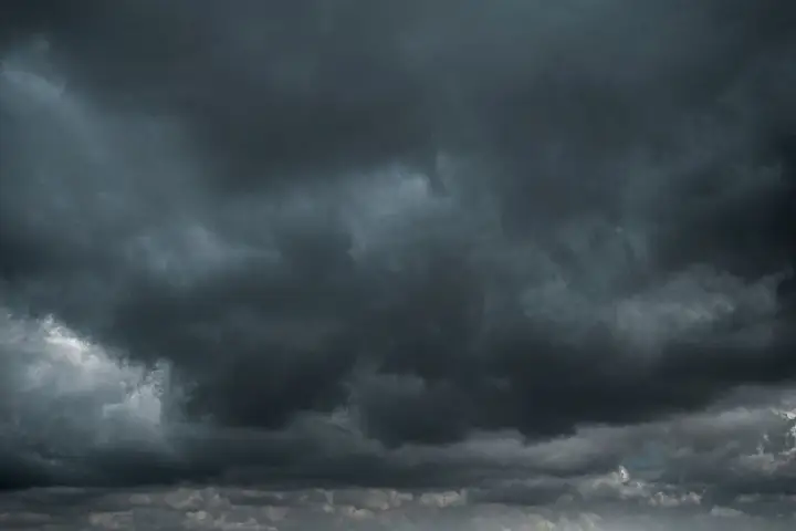 Storm-damaged roof being inspected in North Arkansas after high wind and hail